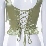 Corset vert en satin avec noeud