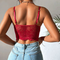 Bustier avec broderie rouge façon corset et bretelle