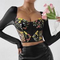 Bustier noir en dentelle avec broderie florale et manches longues